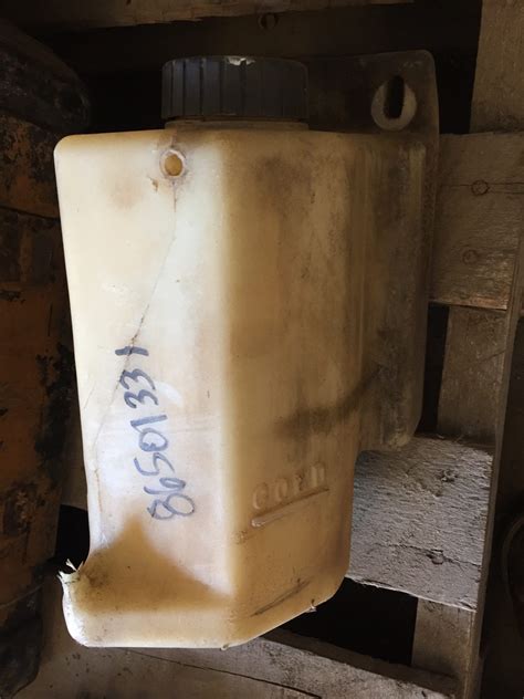 new holland lk665 skid steer coolant recovery tank|86501331 New Holland RESERVOIR, COOLANT E .